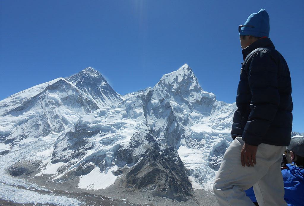 standing in front of the world's highest peak